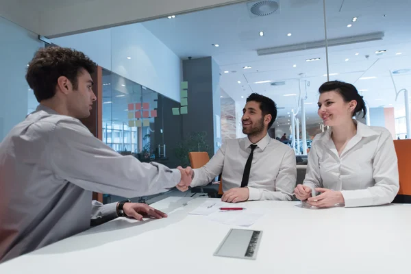 Young couple signing contract documents on partners back — Stock Photo, Image