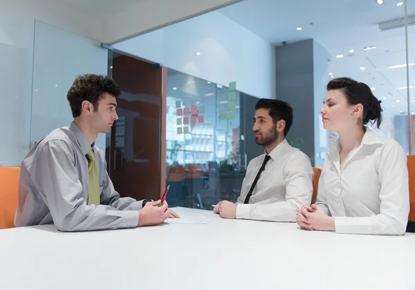 Young couple signing contract documents on partners back — Stock Photo, Image