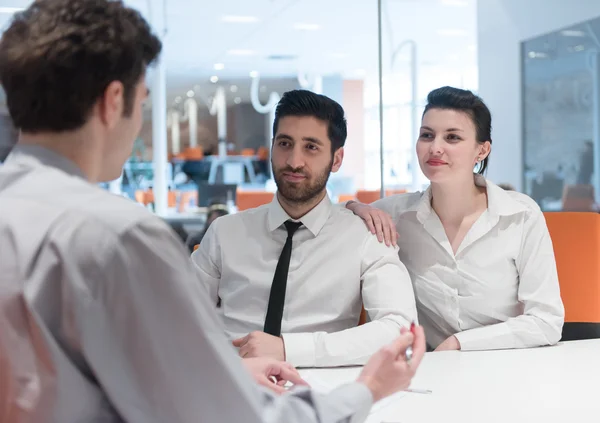 Young couple signing contract documents on partners back — Stock Photo, Image