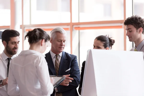 Young startup businessman making presentation to senior investio — Stock Photo, Image