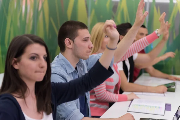 Students group raise hands up — Stock Photo, Image