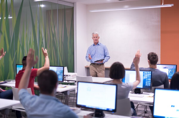 teacher and students in computer lab classroom