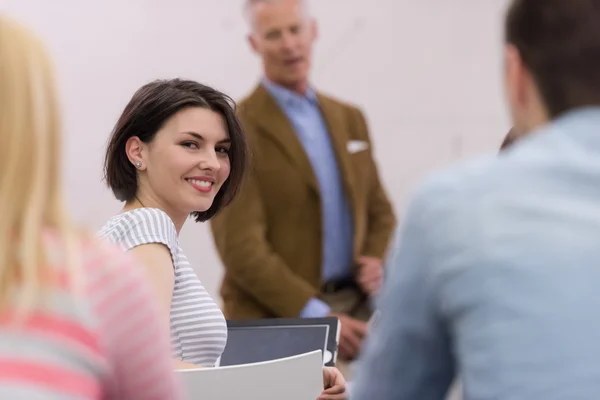 Teacher with a group of hi school students in classroom — Stock Photo, Image