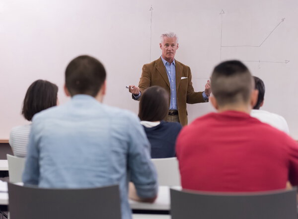 teacher with a group of students in classroom