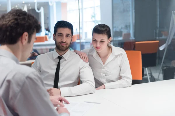 Young couple signing contract documents on partners back — Stock Photo, Image