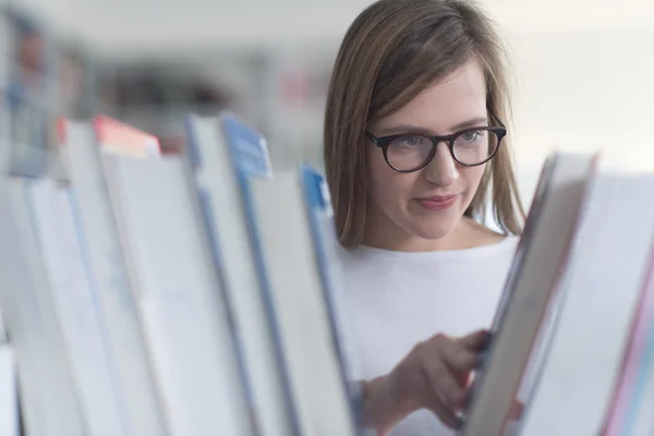 Female student in library — Stock Photo, Image