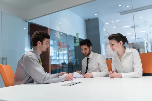 Young couple signing contract documents on partners back — Stock Photo, Image