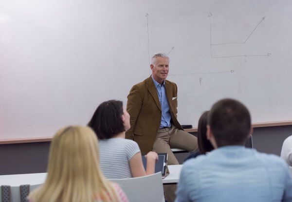 teacher with a group of students in classroom