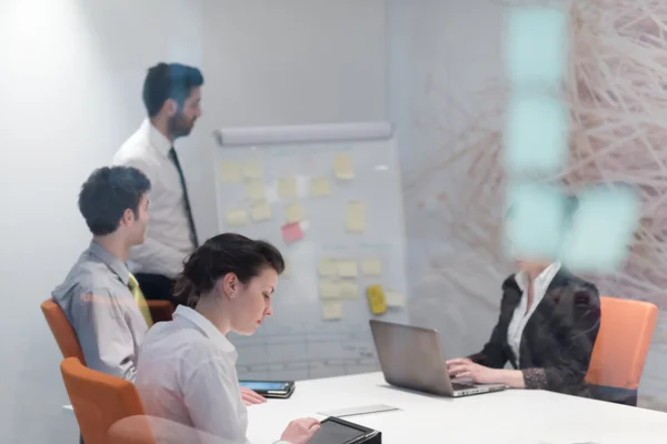 Business people group brainstorming and taking notes to flip boa — Stock Photo, Image