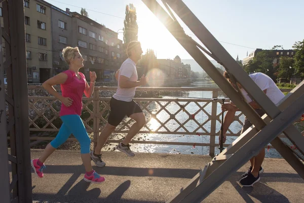 Healthy Mature Couple Jogging City Early Morning Sunrise Background — Stock Photo, Image