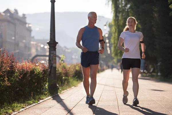 Healthy Mature Couple Jogging City Early Morning Sunrise Background — Stock Photo, Image