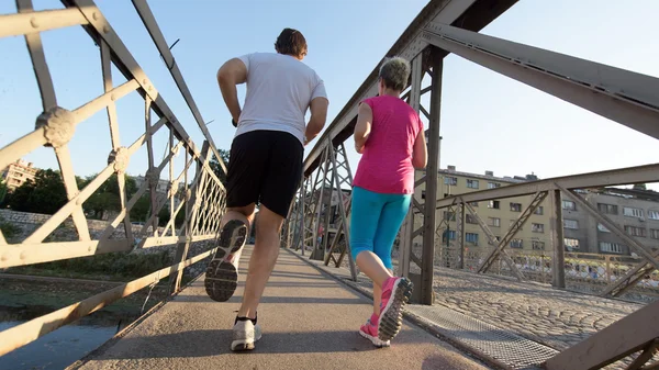 Healthy mature couple jogging — Stock Photo, Image