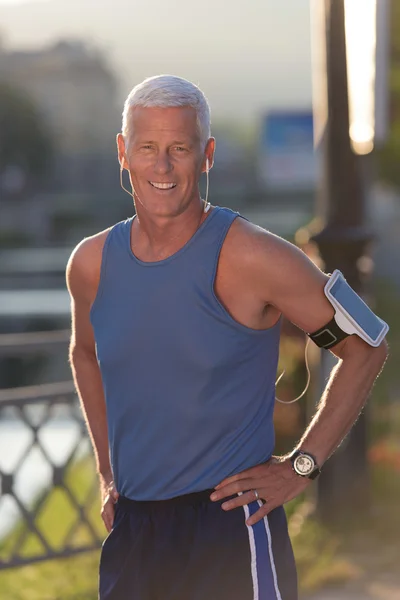 Portrait of handsome senior jogging man — Stock Photo, Image