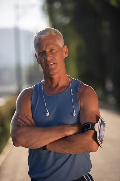 Portrait of handsome senior jogging man — Stock Photo, Image