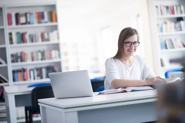 Female student study in school library Royalty Free Stock Photos