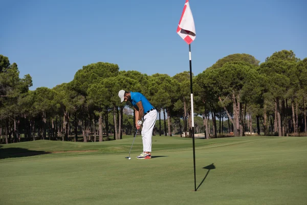 Golf player hitting shot at sunny day — Stock Photo, Image