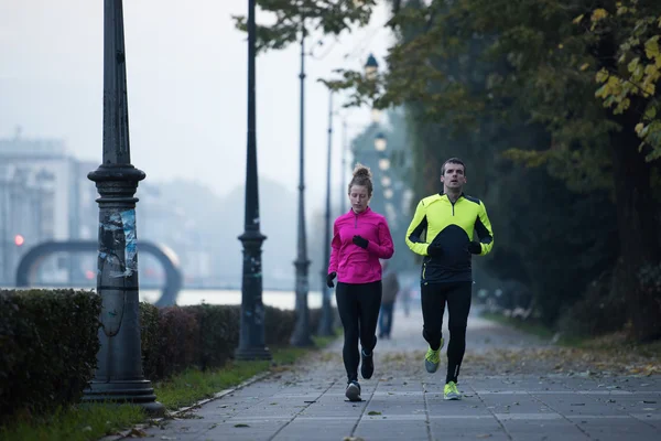 Fiatal pár, jogging — Stock Fotó