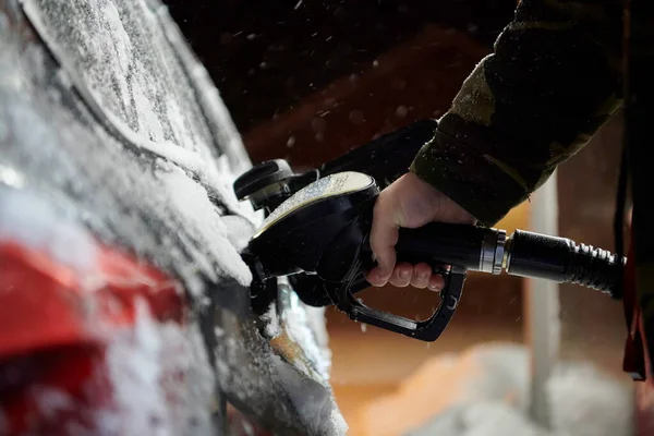 Refuelling diesel gas on petrol station at winter — Stock Photo, Image