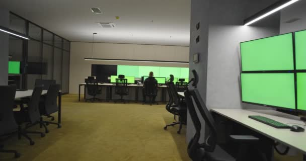 Modern faclity of security or surveillance center with many monitors and cctv cameras with green screan, concept of protection and security with chroma key — Stock Video