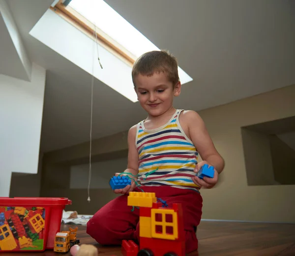 Little boy child playing with creative toys — Stock Photo, Image