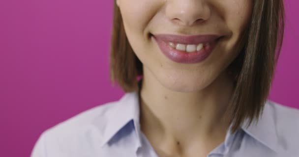 Young woman over isolated pink background smiling and having fun — Stock Video