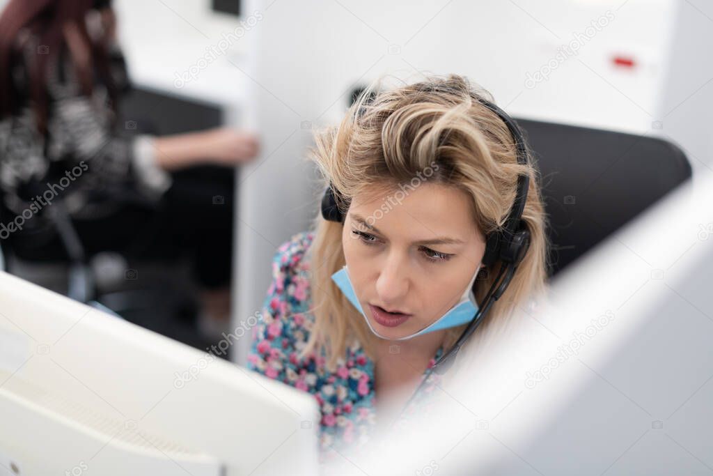 call center operator in medical mask