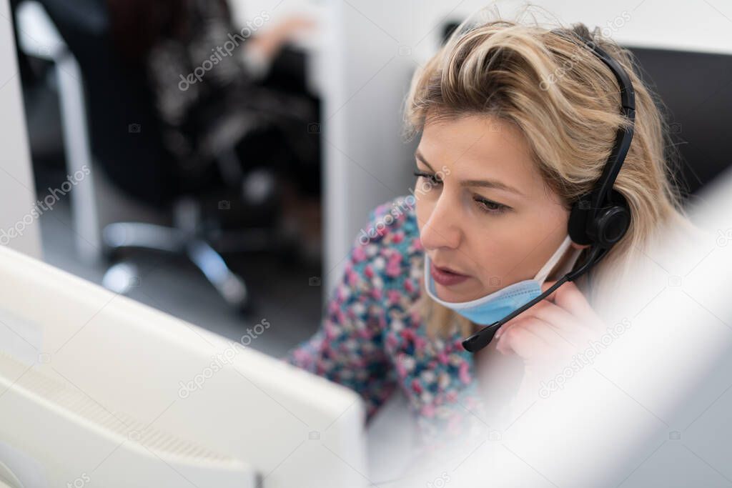 call center operator in medical mask