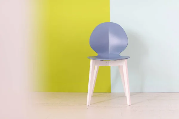 Modern blue chair in front of a blue green background — Stock Photo, Image