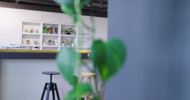 Man working on tablet in modern startup office interior — Stock Video