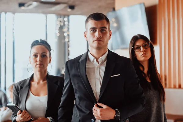 Group of successful business people standing together at office. — стоковое фото