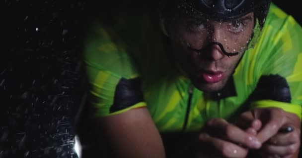 Triathlon Athlete Riding Professional Racing Bicycle Intense Workout Dark Rain — Stock Video