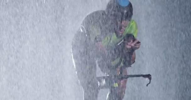 Triathlon Athlete Riding Professional Racing Bicycle Intense Workout Dark Rain — Stock Video