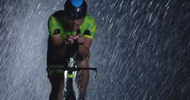 Triathlon Athlete Riding Professional Racing Bicycle Intense Workout Dark Rain — Stock Video