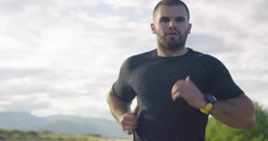 Jogger during intense training in the morning. Runner sprinting during outdoors training for marathon run.