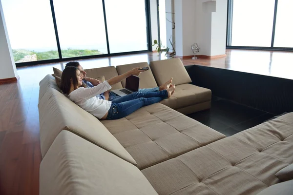 Couple on sofa — Stock Photo, Image