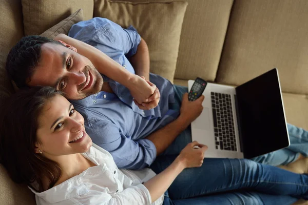 Couple on sofa — Stock Photo, Image