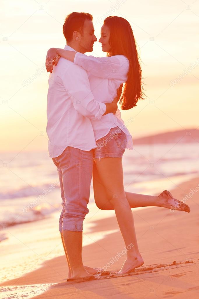 young couple  on beach have fun