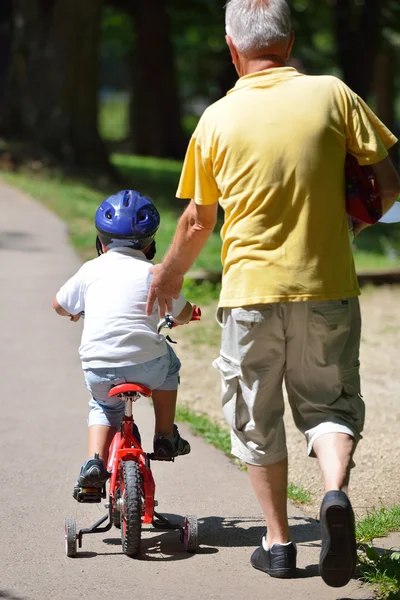 Happy grandfather and child in park — Stock Photo, Image