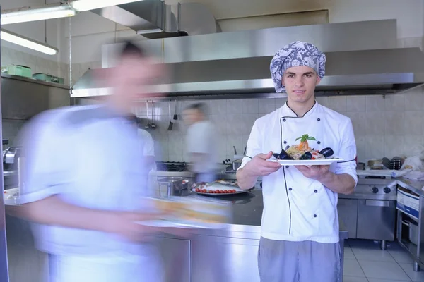 Handsome chef dressed in white uniform — Stock Photo, Image