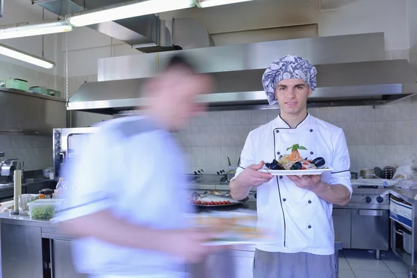 Handsome chef dressed in white uniform — Stock Photo, Image