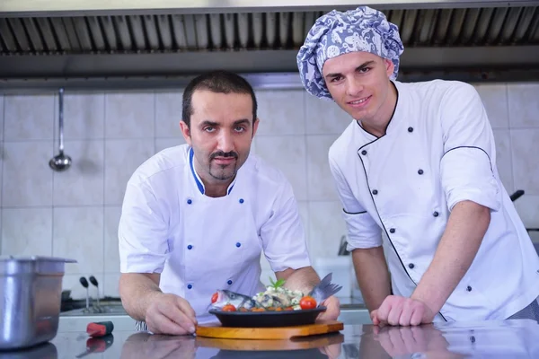 Two handsome chefs at kitchen — Stock Photo, Image