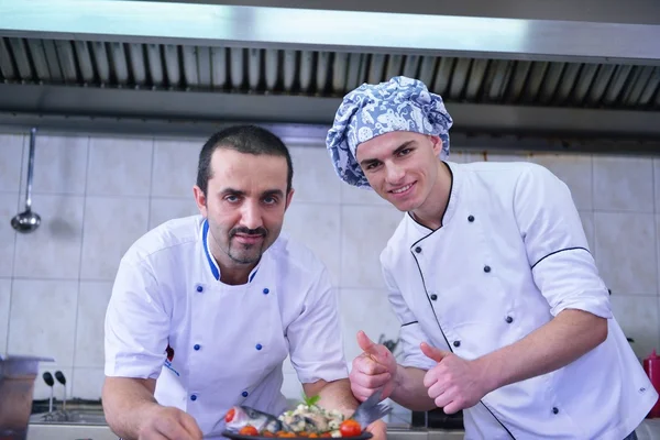 Two handsome chefs at kitchen — Stock Photo, Image