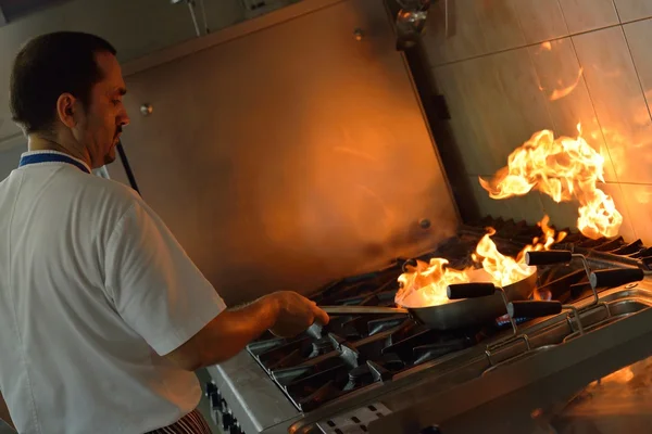 Chef cooking at kitchen — Stock Photo, Image