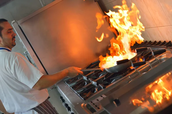 Chef cooking at kitchen — Stock Photo, Image