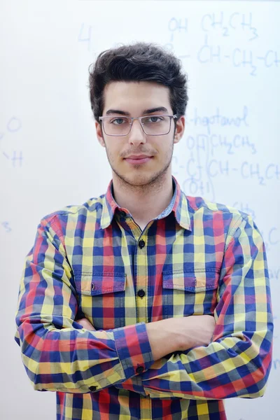 Teenage boy  on chemistry classes — Stock Photo, Image