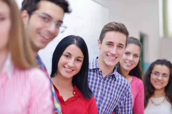 Happy teens group in school — Stock Photo, Image