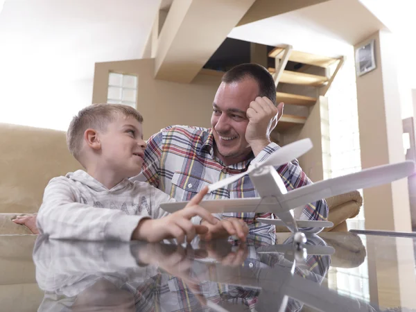Father and son assembling airplane toy — Stock Photo, Image