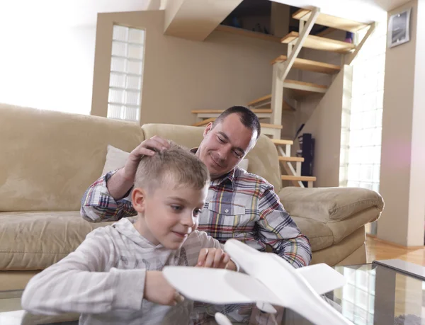 Father and son assembling airplane toy — Stock Photo, Image