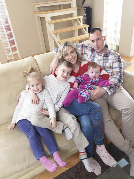 Happy young family at home — Stock Photo, Image