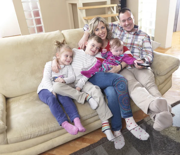 Happy young family at home — Stock Photo, Image